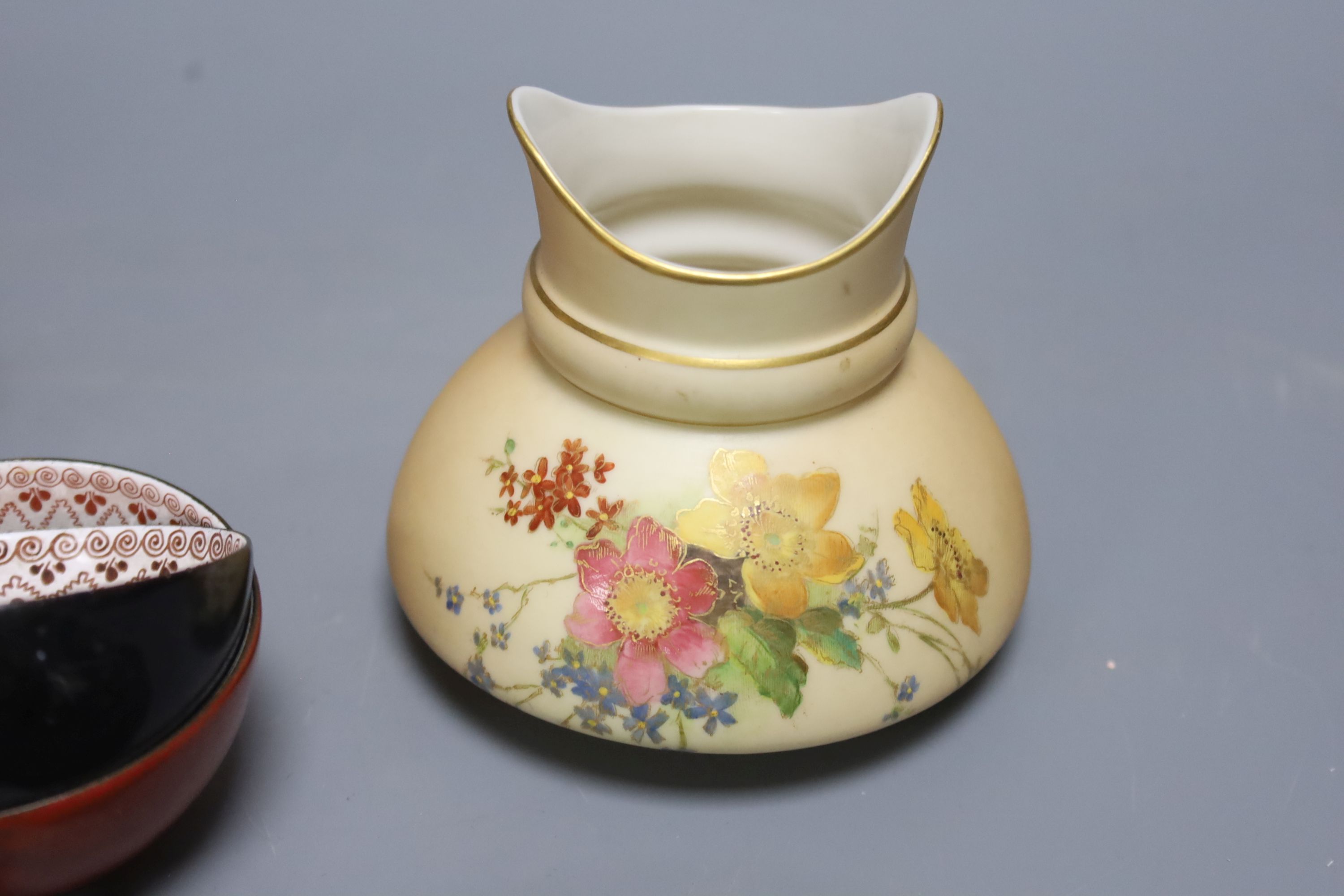 Two Royal Worcester blush pots and a set of six enamelled metal cups and saucers